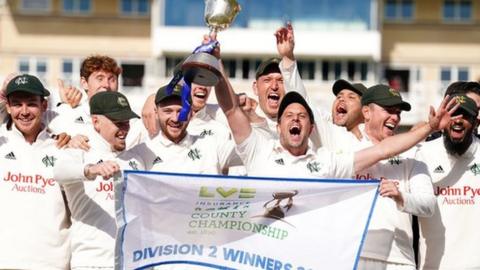 Notts players celebrate winning the Division Two title