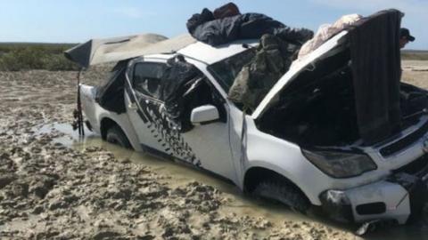 A picture of the vehicle submerged in mud