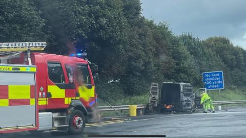 Fire service attending van on fire