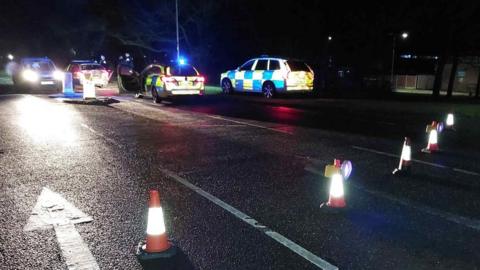 Police cars and a cordon on Doddinghurst Road