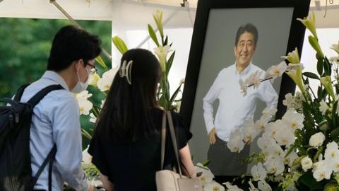 Mourners attend a vigil for Shinzo Abe