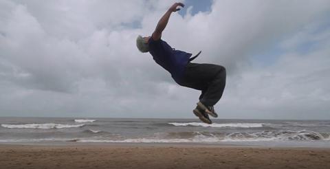 Eshwar Tiwari breakdancing on a beach in Mumbai.