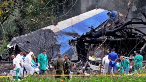 Police and military personnel work among the wreckage of the Boeing-737 plane that crashed shortly after taking off from the Jose Marti airport in Havana, Cuba, 18 May 2