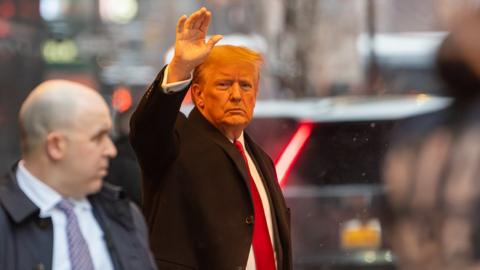 Former President Donald Trump, second right, departs Trump Tower in New York, US, on Tuesday, Jan. 16, 2024. Fresh off his victory in the Iowa Republican caucuses, Donald Trump is set to face a New York jury this week in the next high-stakes trial of his crowded legal calendar, a defamation lawsuit by writer E. Jean Carroll, who claims he raped her in the 1990s. Photographer: David Dee Delgado/Bloomberg via Getty Images