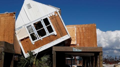 A house tilted on its side in Mexico Beach