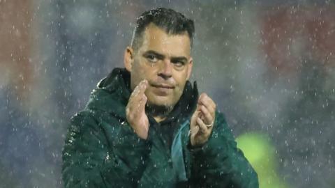 David Horseman applauds fans after the team's loss to Stockport