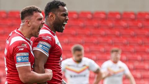 King Vuniyayawa (right) celebrates scoring Salford's opening try against Catalans Dragons