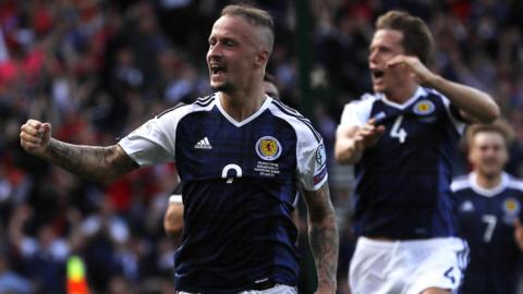 Leigh Griffiths celebrates one of his two strikes against England in the World Cup qualifier at Hampden