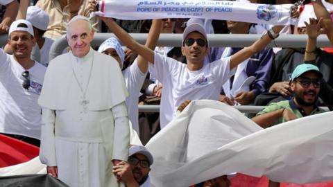 Worshippers sit in the stands of the Air Defense Stadium where Pope Francis will celebrate mass for Egypt's Catholic community in Cairo, Egypt, 29 April 2017.