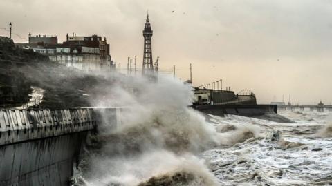 A huge wave buffets the sea wall in Blackpool
