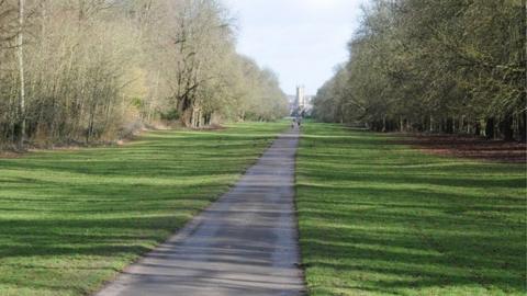 View to the east along Broad Ride in Cirencester Park, aligned with the tower of the Church of St John the Baptist.