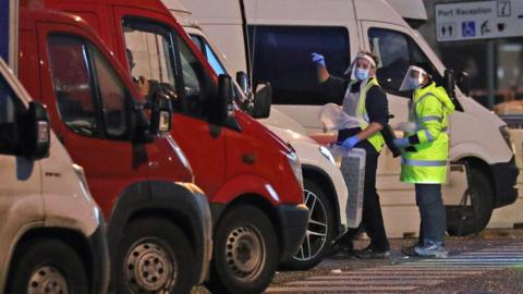 Testers prepare to take samples from drivers parked in the Port of Dover in Kent after French authorities announced that the coronavirus ban was lifted and journeys from the UK will be allowed to resume, but that those seeking to travel must have a negative test result. PA Photo. Picture date: Wednesday December 23, 2020.