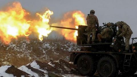 Ukrainian soldiers fire an anti-aircraft gun at a position near Bakhmut. February, 2023