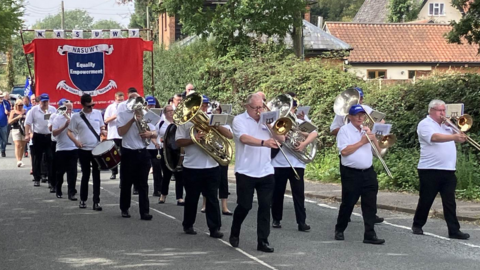 Burston Strike School Rally parade with musicians and union banner