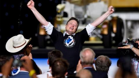 SpaceX CEO and owner Elon Musk celebrates after the launch of a SpaceX Falcon 9 rocket and Crew Dragon spacecraft
