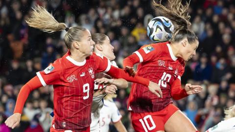 Switzerland's forward Ana Maria Crnogorcevic (L) and Ramona Bachmann (C) in action against Norway