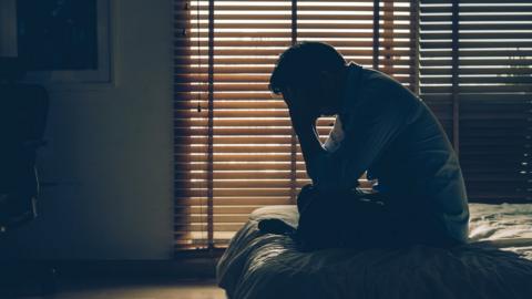 Man sitting in the dark