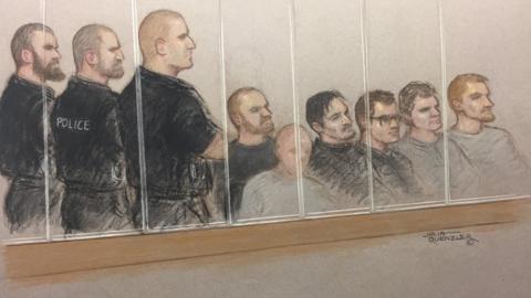 Court artist drawing of six alleged members of National Action