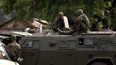 Guinea soldiers on a military vehicle