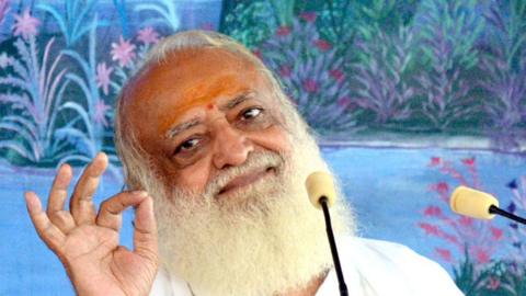 This photograph taken on August 11, 2013, shows self-styled Indian 'godman' Asaram Bapu as he gestures during a ceremony in Jodhpur.