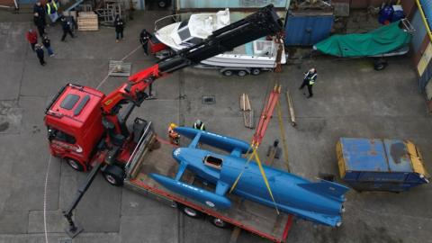 The restored hydroplane boat, Bluebird K7 is loaded onto a lorry in North Shields