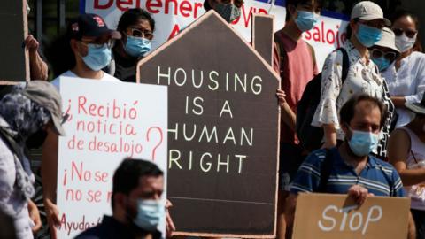 People protest in support of temporarily pausing evictions