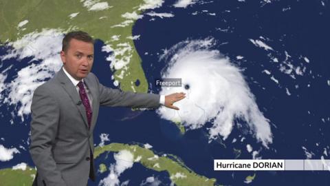 Matt Taylor points out the eye of Hurricane Dorian