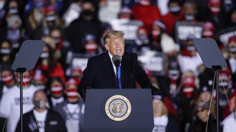 US President Donald J. Trump speaks at a campaign rally at the Waukesha County Airport in Waukesha, Wisconsin, USA, 24 October 2020