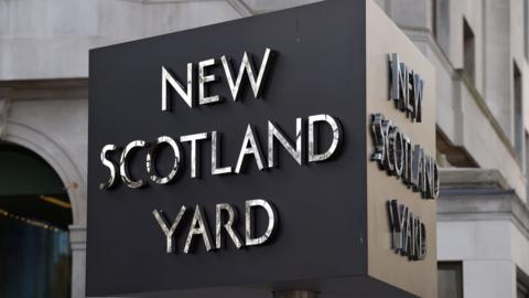 New Scotland Yard sign outside the Metropolitan Police headquarters in London