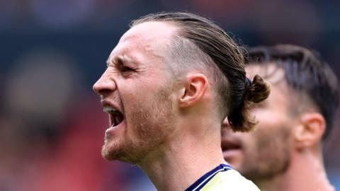 Will Keane celebrates a goal for Bristol City