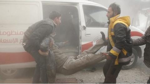 Injured man carried to ambulance after air strike on Douma, in the Eastern Ghouta (7 February 2018)