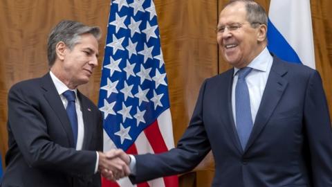 US Secretary of State Antony Blinken and Russian Foreign Minister Sergei Lavrov shake hands during bilateral talks on soaring tensions over Ukraine in Geneva, Switzerland