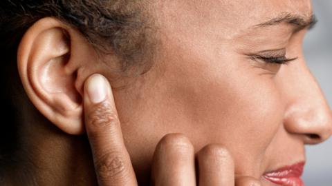 Stock photo of someone with a painful ear