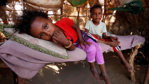 Children rest on a bed at their family hut on the outskirts of the Red Sea port city of Hudaydah, Yemen (12 November 2017)