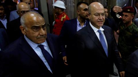 Iraq's Prime Minister-designate Adel Abdul Mahdi (Left) and Barham Saleh (Right) walk out of the Iraqi parliament on 2 October 2018