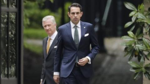 King Philippe of Belgium (left) welcomes chairman of Vlaams Belang party Tom Van Grieken (right) ahead of a meeting at the Royal Palace