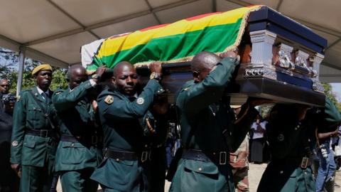 A coffin containing the body of former Zimbabwean President Robert Mugabe arrives at his rural village in Kutama, Zimbabwe, September 28, 2019