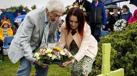 Paul Maxwell's parents laid a wreath