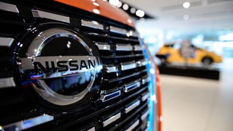 Nissan has seen its shares plunge by 10% in Tokyo trading after warning that it would see a record annual loss.