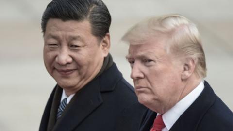 China's President Xi Jinping (L) and US President Donald Trump attend a welcome ceremony at the Great Hall of the People in Beijing on November 9, 2017.