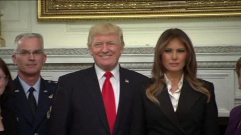 Donald Trump and Melania Trump pose with military leaders