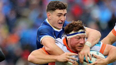 Leinster's Cormac Foley tackles Edinburgh's Hamish Watson