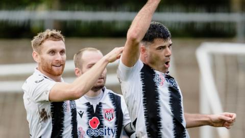 Michael Wilde celebrates after scoring for Flint