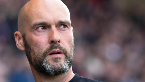 Notts County boss Luke Williams watches his side in action from the sideline