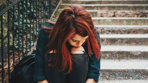 Girl sitting on steps