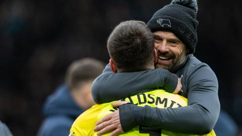 Derby boss Paul Warne hugs goalkeeper Joe Wildsmith