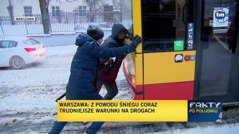 Belarusian man pushing bus in Warsaw