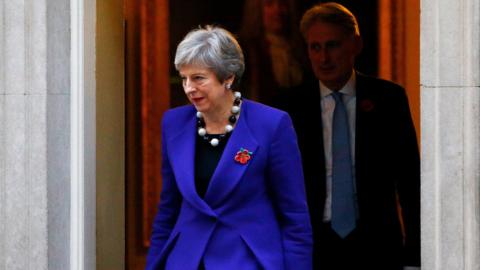 Theresa May and Philip Hammond leave 10 Downing Street