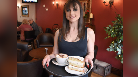 Sara Bailey with order at her Rhondda Cynon Taf café