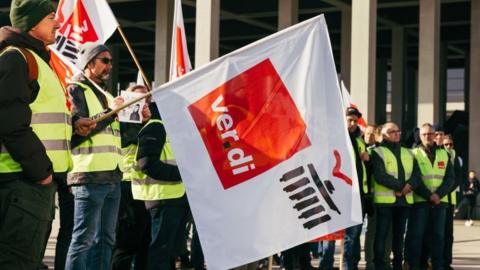 Workers demonstrate during a strike organised by the Ver.di union, at Berlin Brandenburg Airport, in Berlin, Germany, on Thursday, March 7, 2024